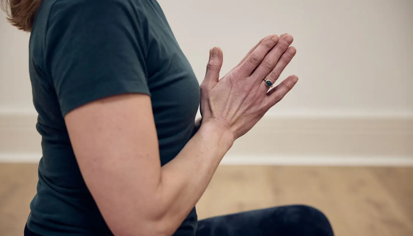 Hands in the prayer position while doing yoga