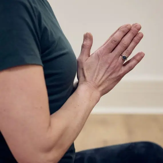 Hands in the prayer position while doing yoga