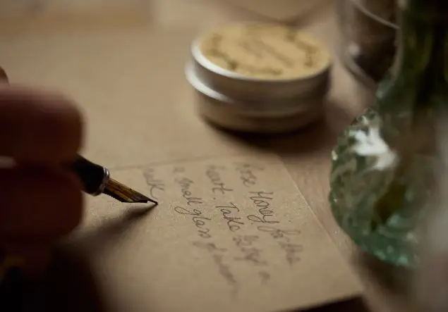 Writing ingredients in a notebook